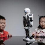 Kids amazed by a humanoid robot during an indoor play session, showcasing technology and learning.