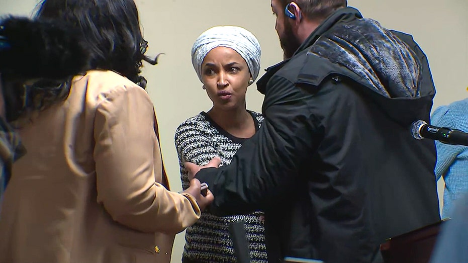 Ilhan Omar hit with unknown spray and other highlights from chaotic Minneapolis town hall