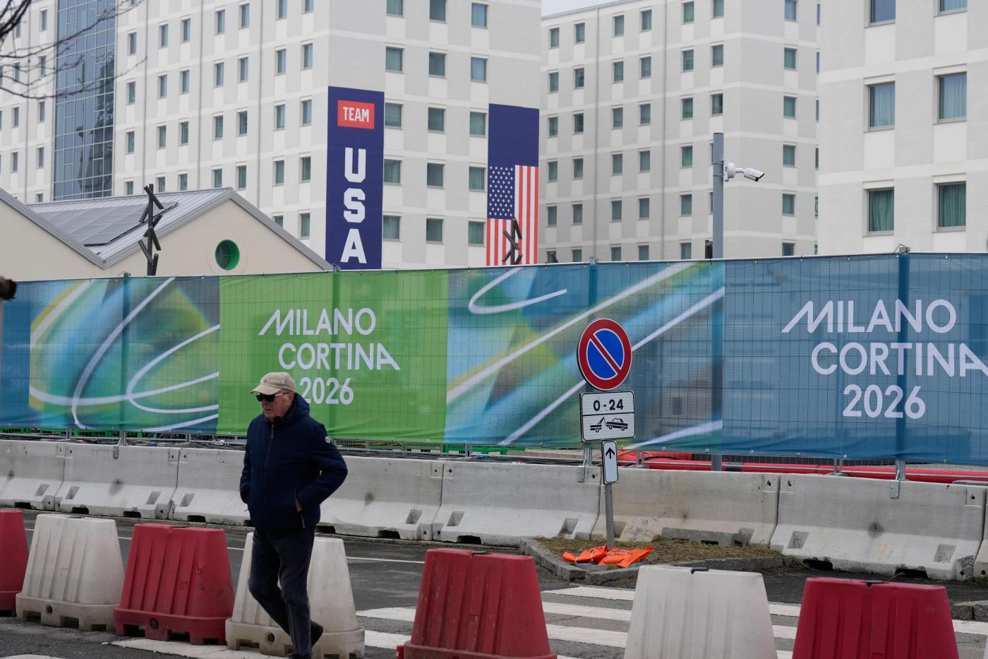 Athletes bring Milan Olympic Village to life, complete with Italian bidets and 4-story US banners